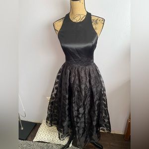 CeCe black party, cocktail prom dress size 2. Sheer lined skirt satin bodice